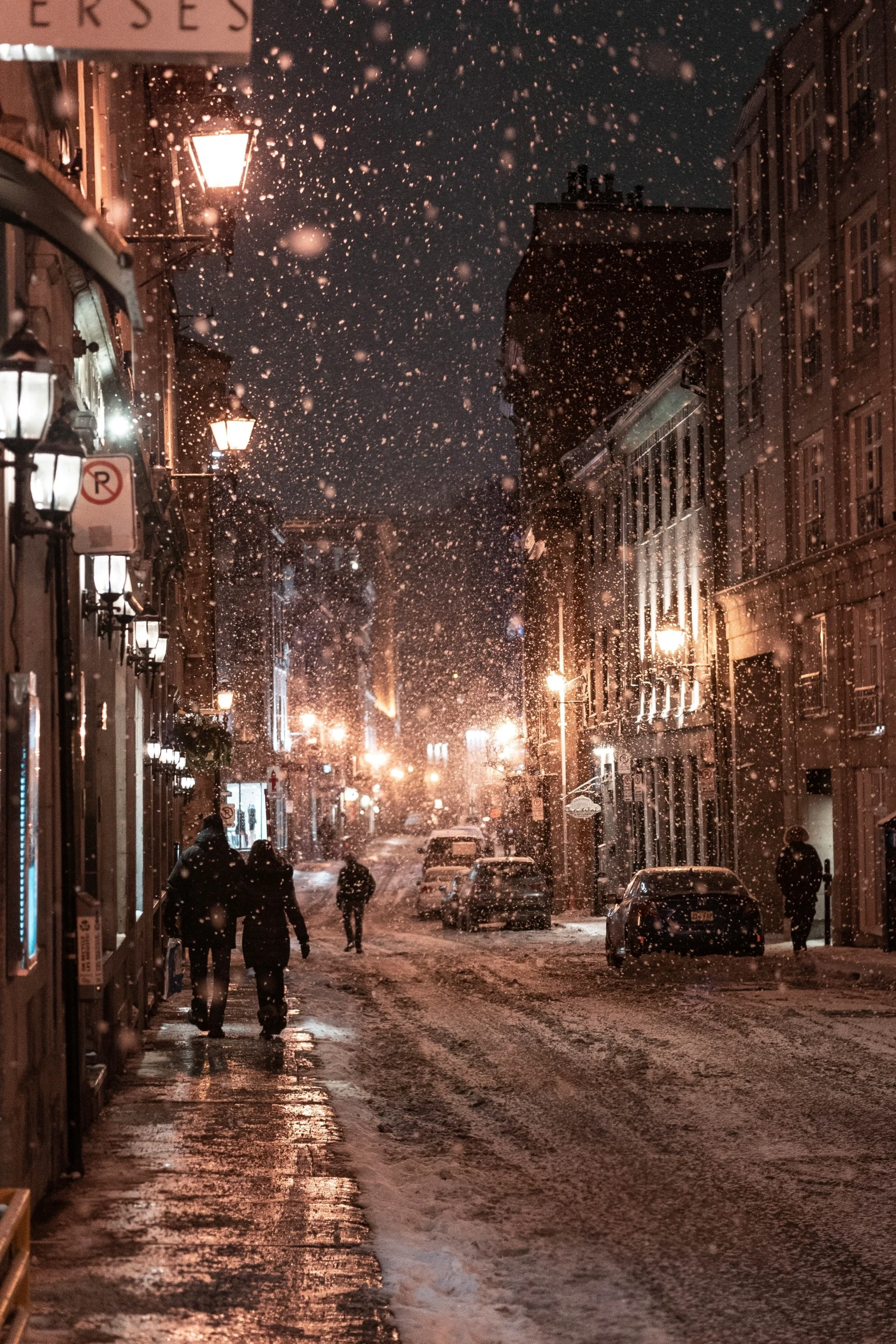 a snowy night in a city at some sort of winter time