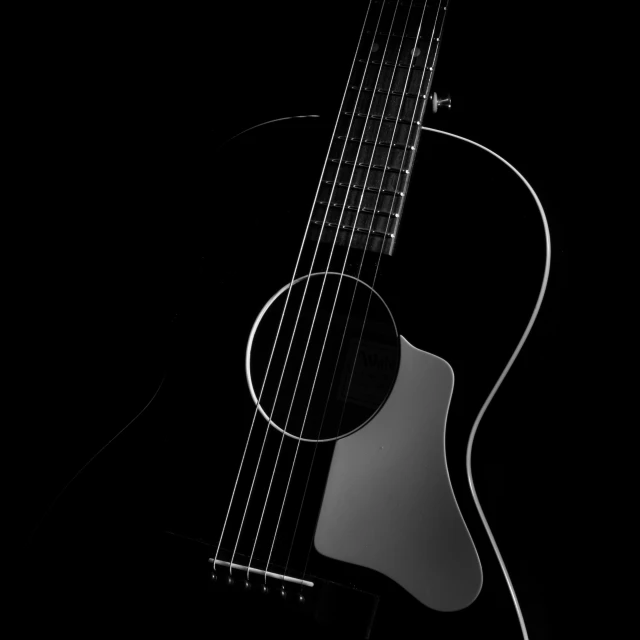 the front of a guitar is shown against a black background