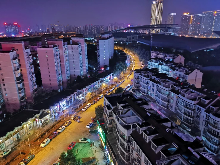 the lights of cars on an urban street in the evening