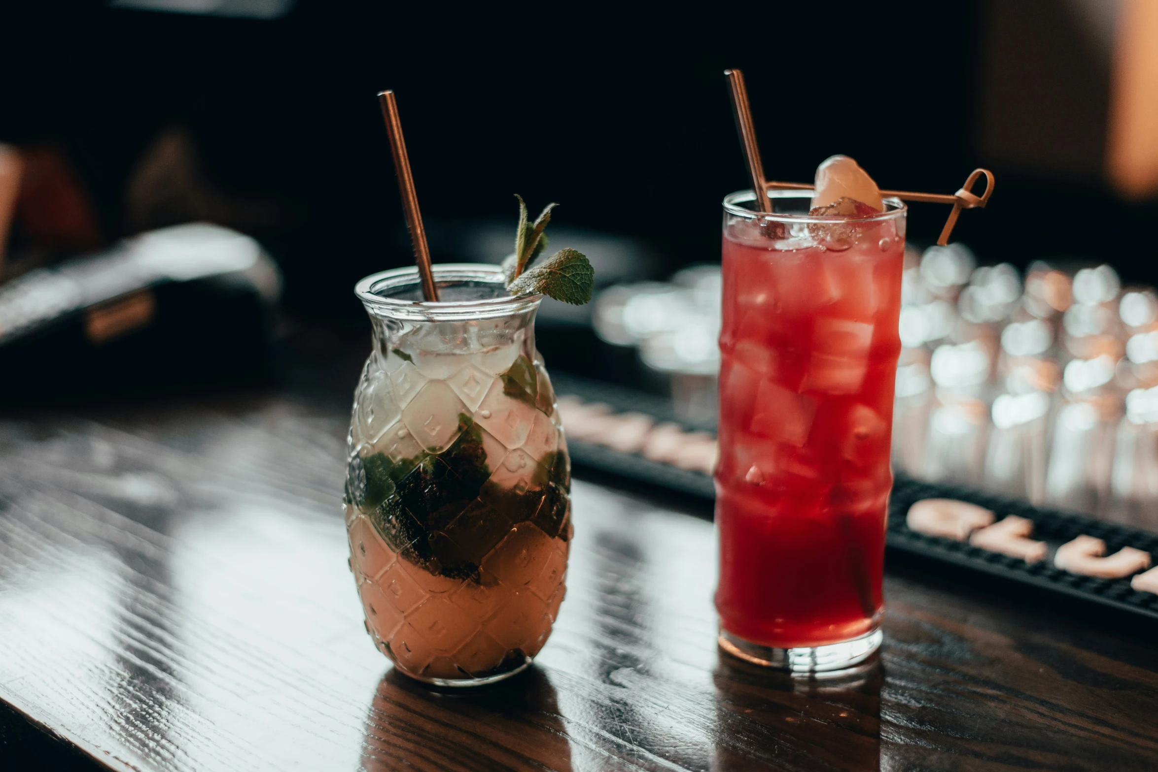 two glasses of drink are sitting on a table