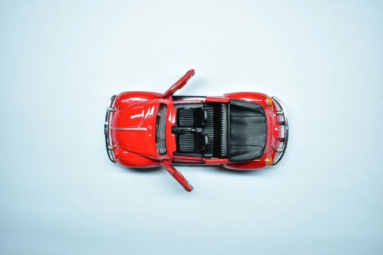 an overhead view of a red toy car