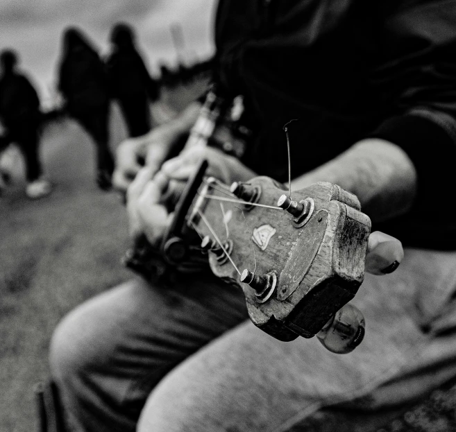 a man holding an empty glass bottle on his hand