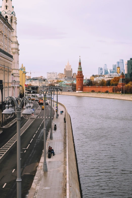 a few people on motorcycles next to a river