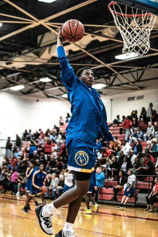 a man jumping up to dunk a basketball