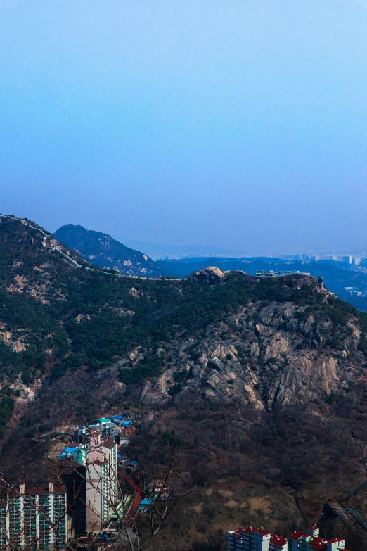 the top of a very tall hill with a view