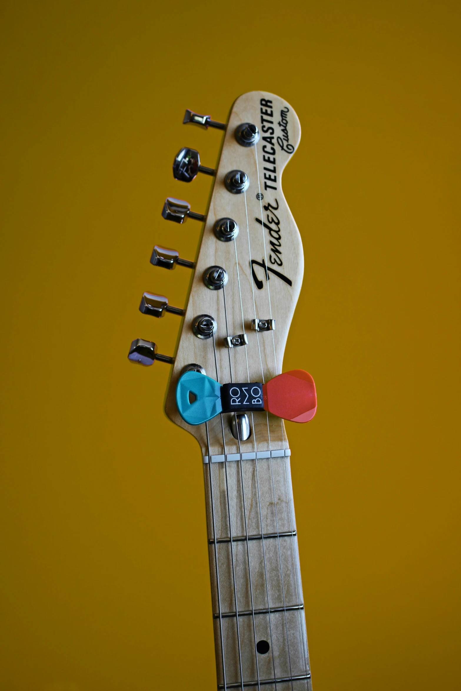 the neck of an electric guitar with multiple s
