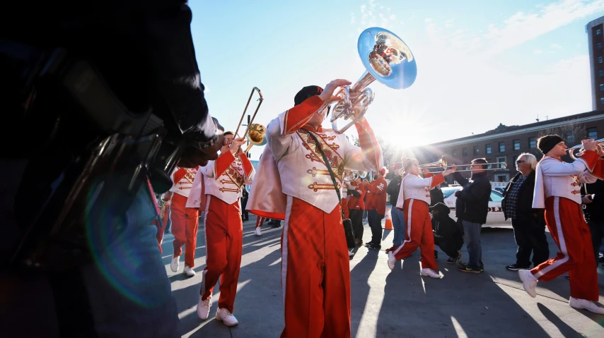 an image of a marching band playing in the street