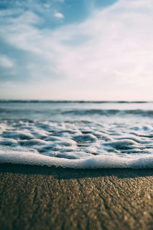 a po of a beach and the waves coming in