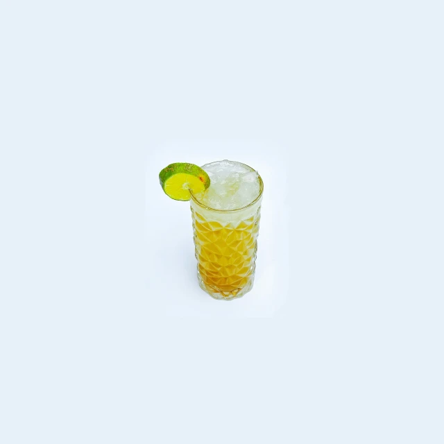 a glass with a drink garnished with a lime