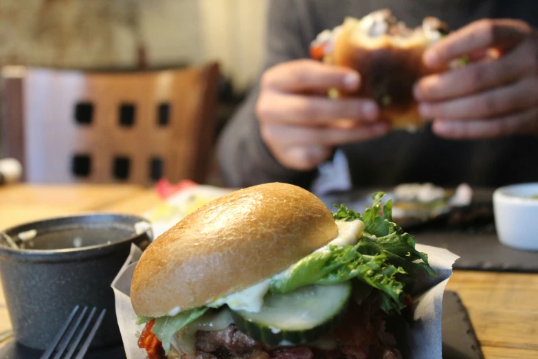 a sandwich is placed in a paper tray