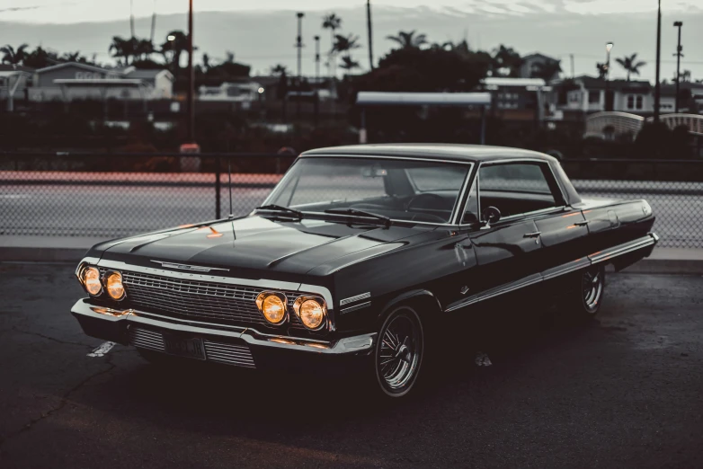 a black car parked on the side of the road