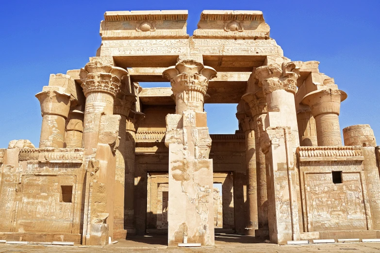 a stone structure surrounded by large columns and pillars