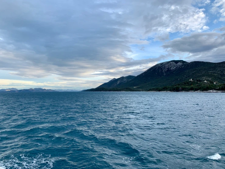 a view of the water from a boat in the middle of the ocean