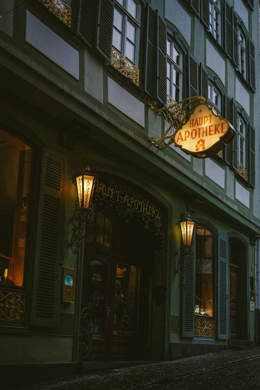 a building with a sign lit up at night