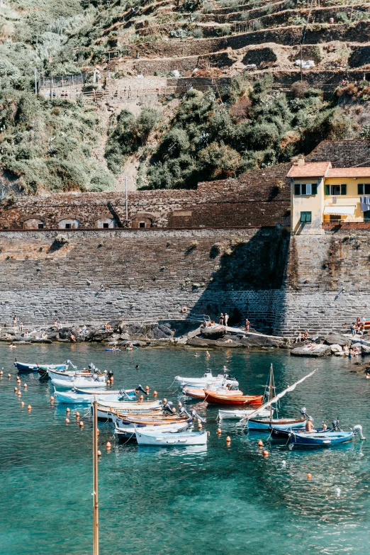 small boats sit at the dock on the water