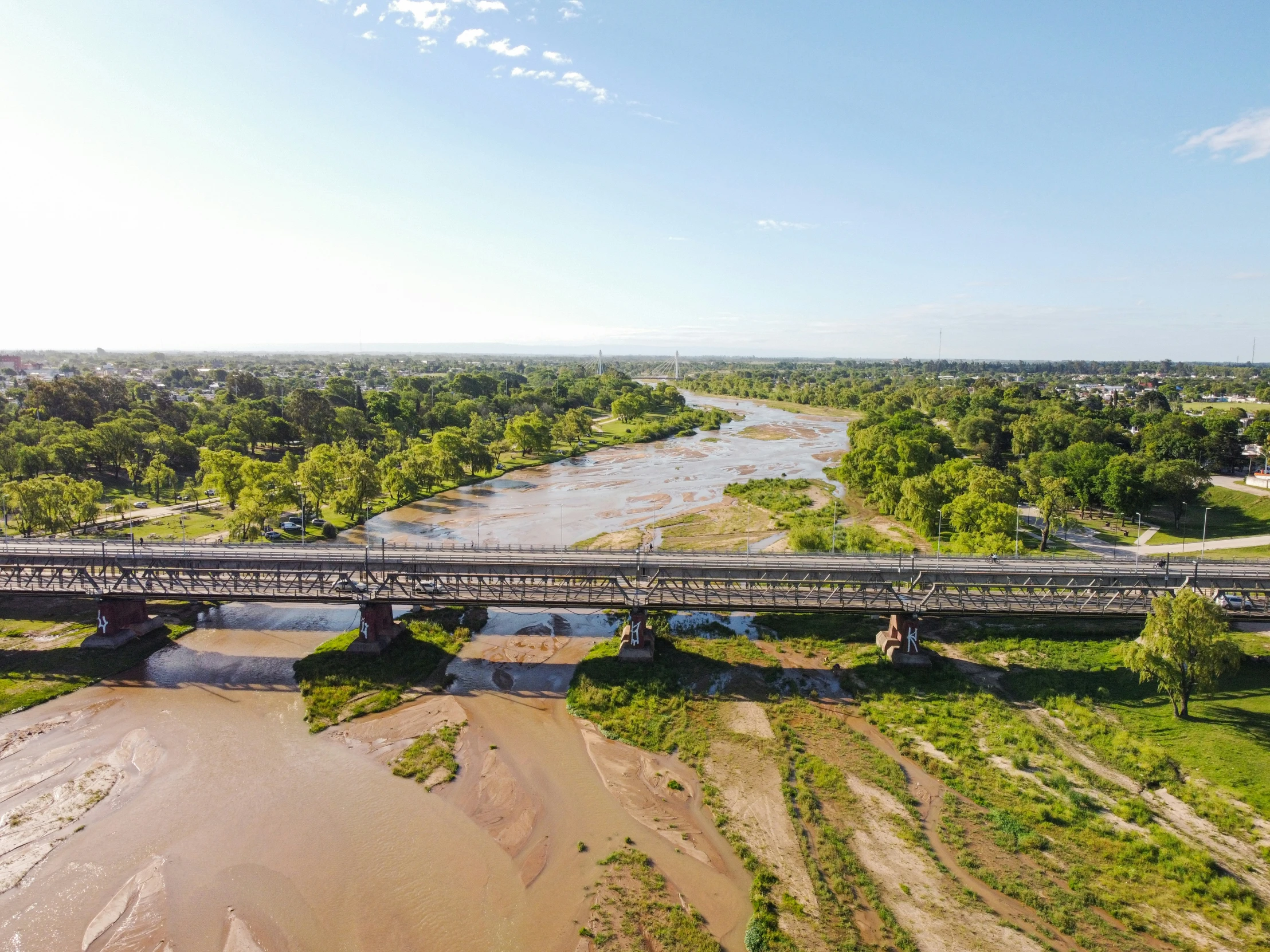 there is a bridge crossing a wide river