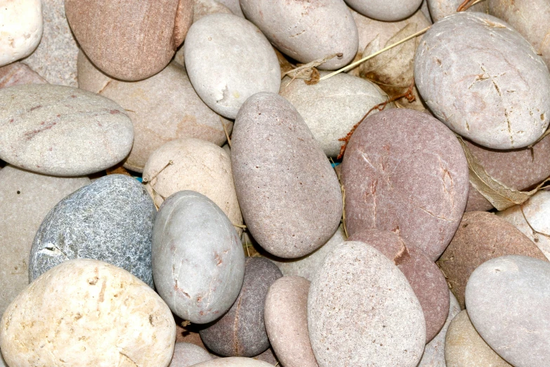 close up of various rocks on a beach