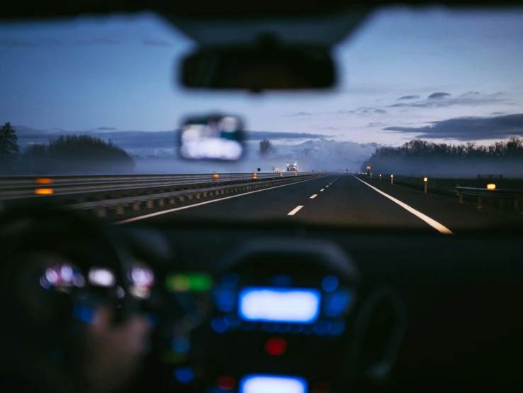 view of street from inside of car showing highway