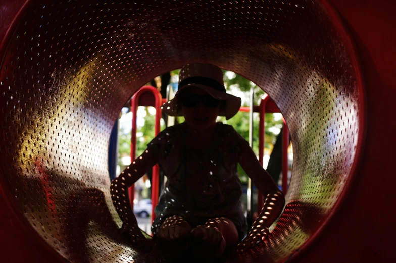 there is a woman standing in the middle of a play structure