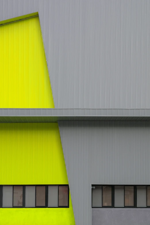 a yellow and a green building behind a blue door