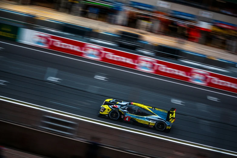 a car on a track racing fast down