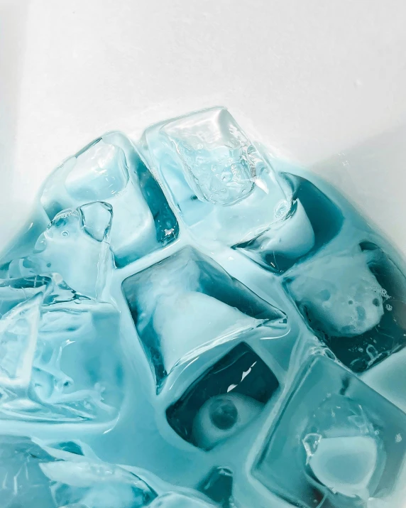 ice cubes in a square shape on a light blue surface