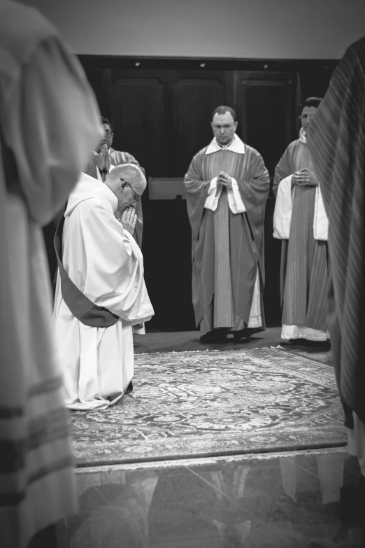 a black and white po of priests and monks