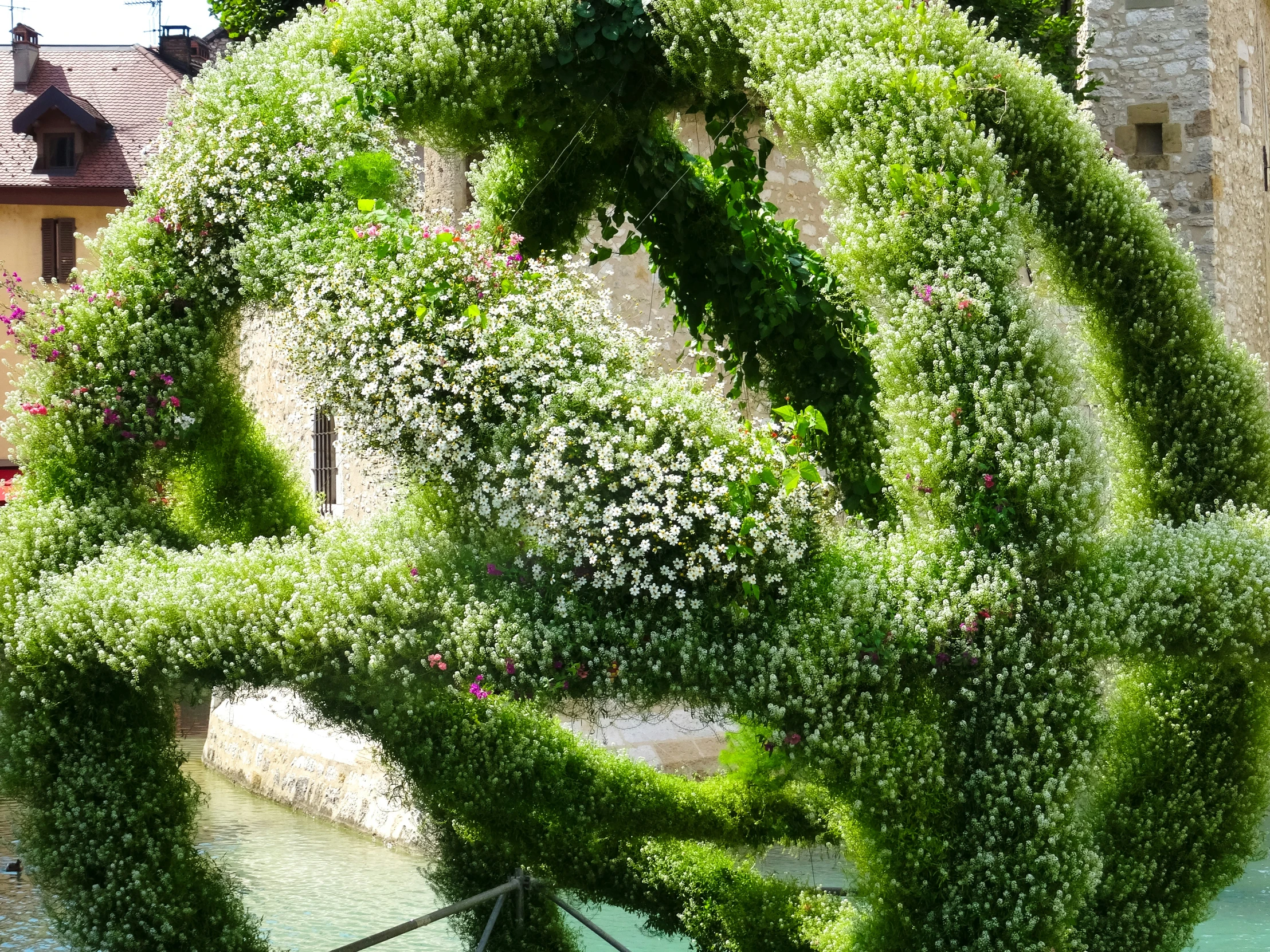 a large circular sculpture is made from grass