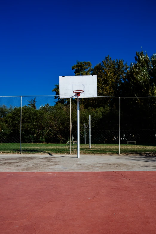 a basketball hoop sitting on top of a basketball court