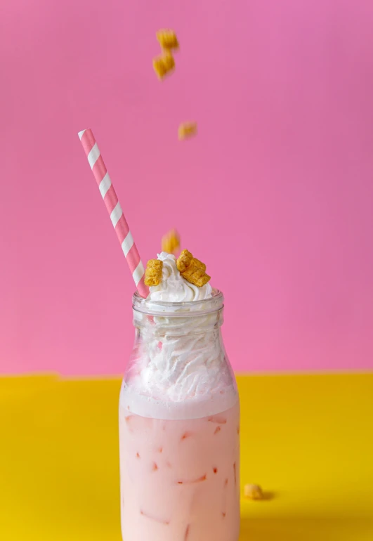 a pink drink with marshmallows on top