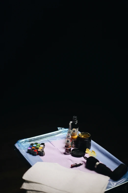 a bottle and some empty bottles on a table