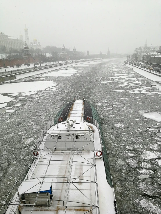 a very long train next to some snow