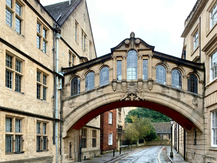 an arch leading into a large building in the city