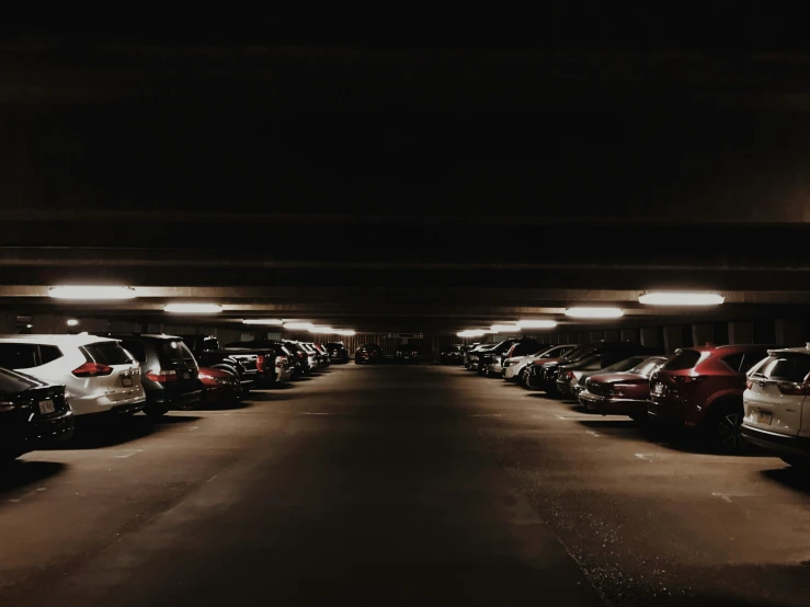 an empty car park filled with parked cars