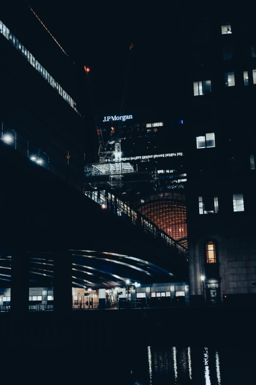 a city skyline in a blur with a bridge over water