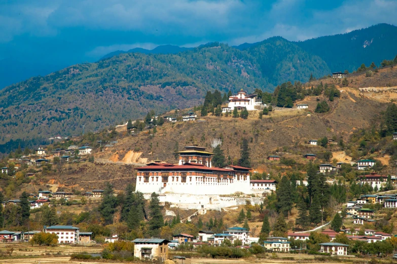 a view of a large building in the middle of a valley