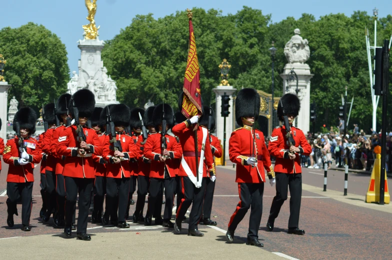 soldiers marching down the street at a ceremony