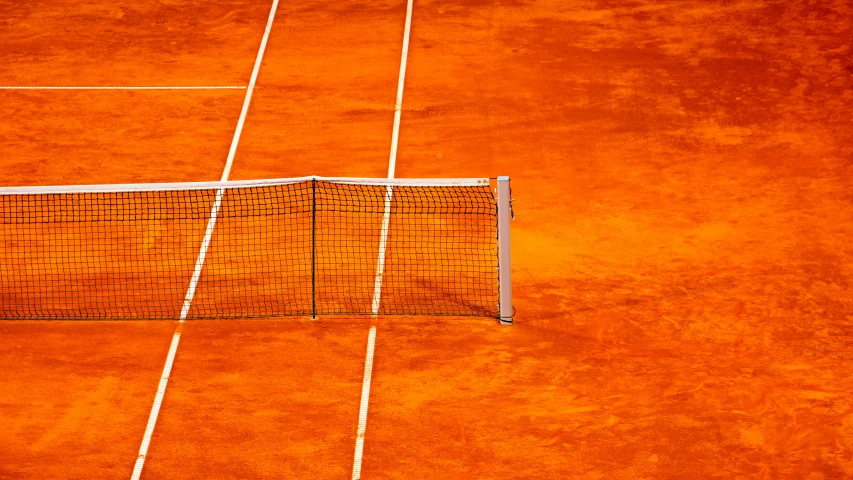 a tennis player serving the ball on a court