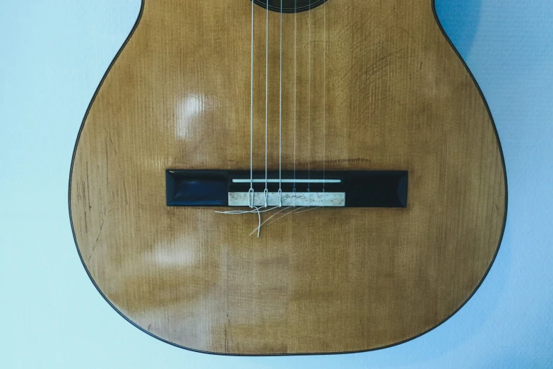 a close up of an acoustic instrument attached to a wall