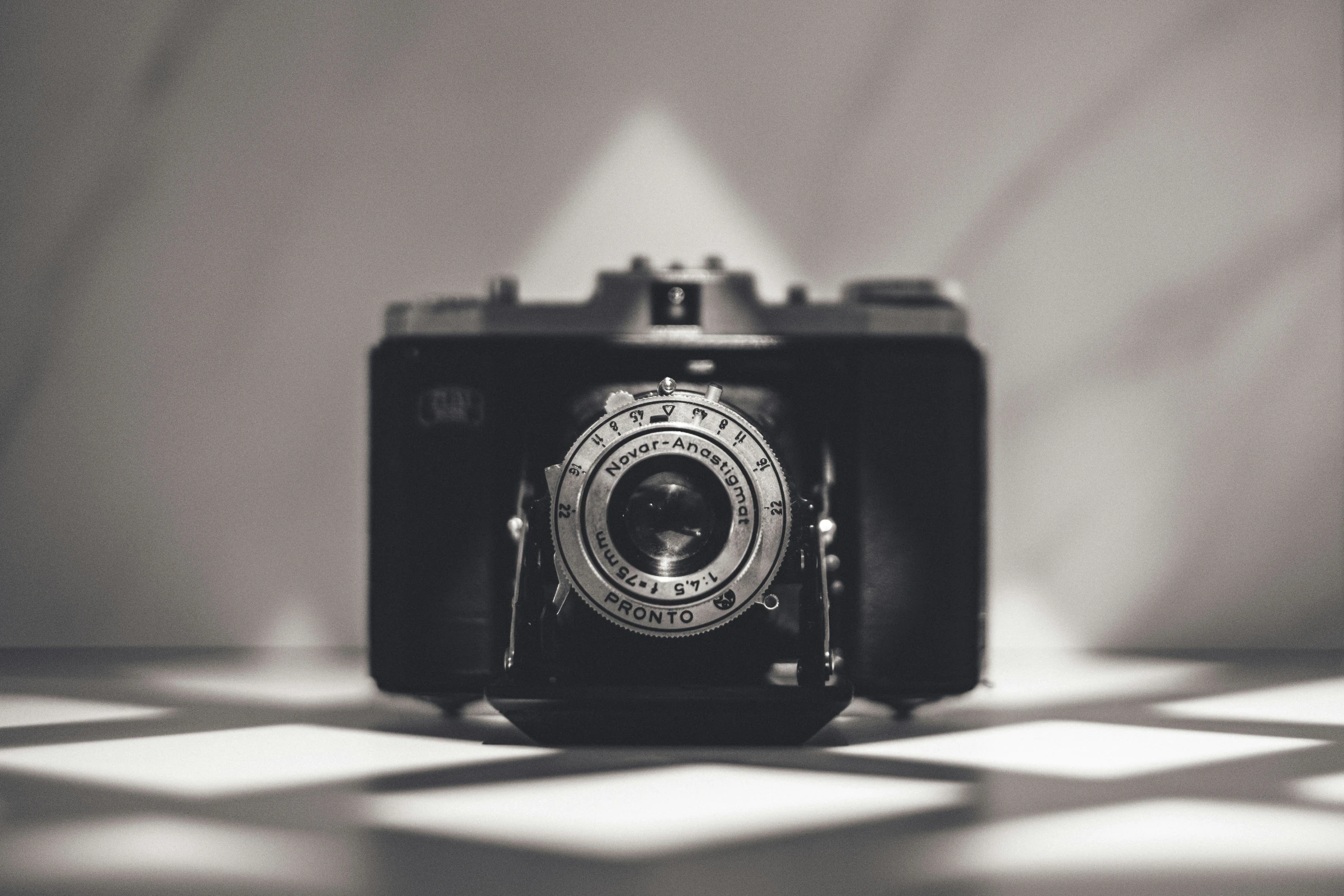 an old camera sitting on top of a table