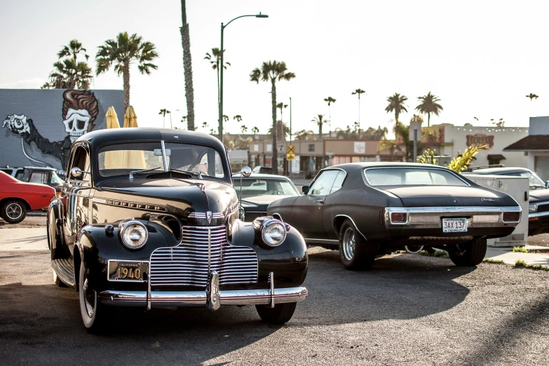 a classic car parked in a parking lot