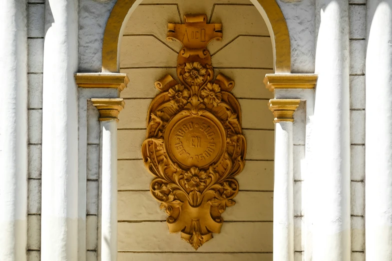 the wall clock has many carvings on it