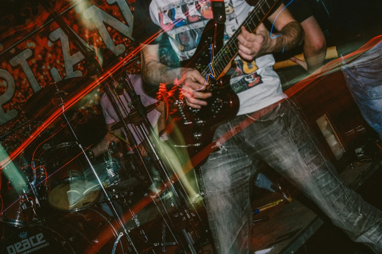 a man is playing a guitar in a music club