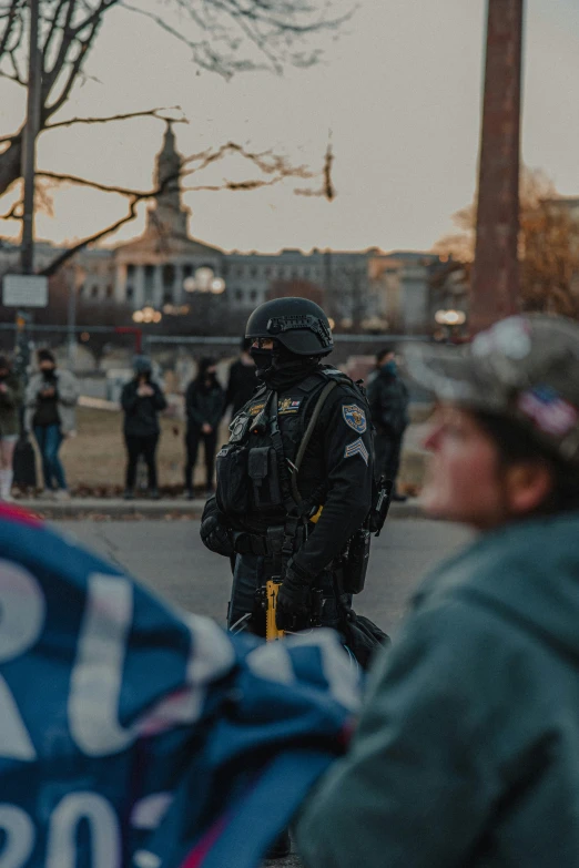 police officers in full uniforms on motorcycles with flags