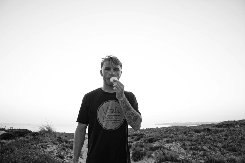 a man on a hill brushing his teeth