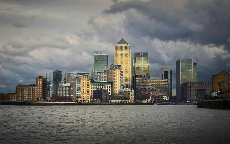 a city with some very large buildings and a body of water