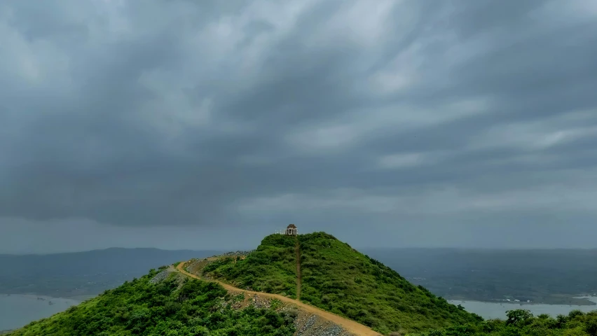 a person standing at the top of a hill