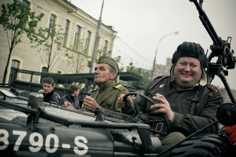 a group of people sitting on top of a motorcycle