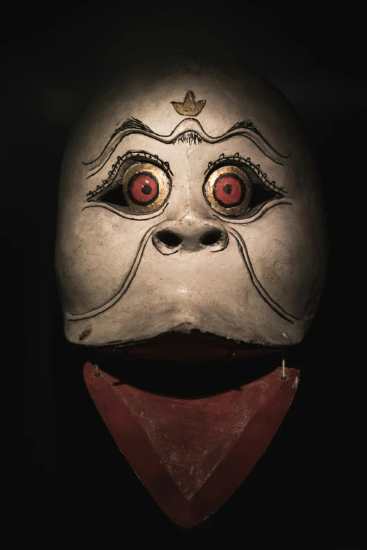 this is an mask that has a face with a smile on it