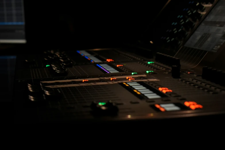 the sound board in the studio has colored light effects